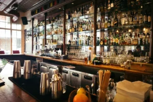 Bar with lots of alcohol bottles in the background